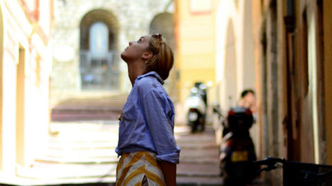 student gazing at building